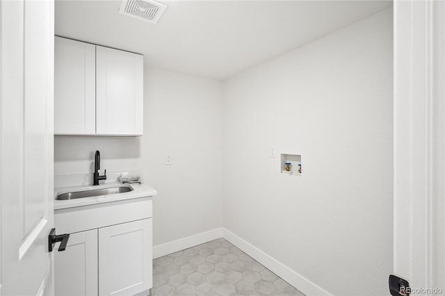 5569 Willow Springs Dr, Morrison, CO 80465 - washroom with hookup for a washing machine, cabinet space, and bar with sink