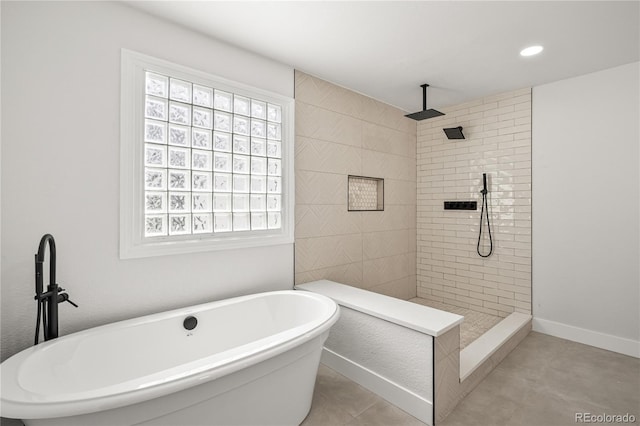 5569 Willow Springs Dr, Morrison, CO 80465 - bathroom featuring healthy amount of natural light, a freestanding bath, a walk in shower, and recessed lighting