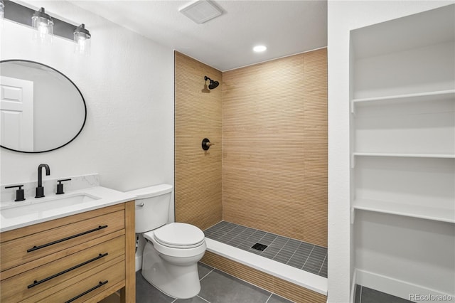 5569 Willow Springs Dr, Morrison, CO 80465 - bathroom with vanity, a tile shower, and tile patterned floors