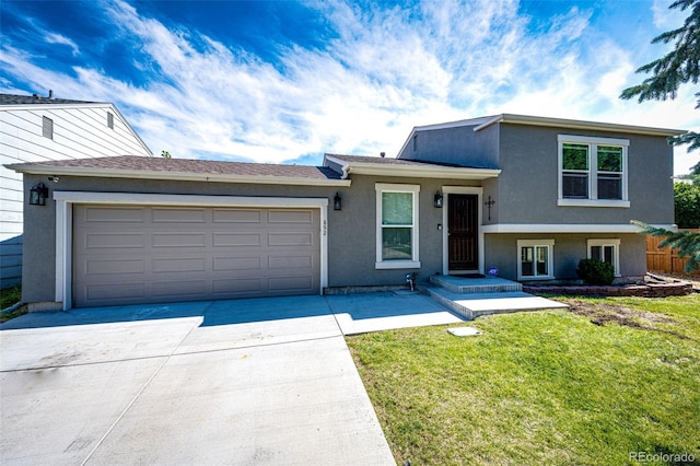 tri-level home featuring a front yard and a garage