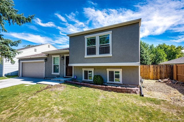 view of front of house with a front yard and a garage