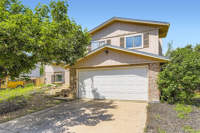 3235 S Newland St, Denver, CO 80227 - view of front of house with brick siding and concrete driveway