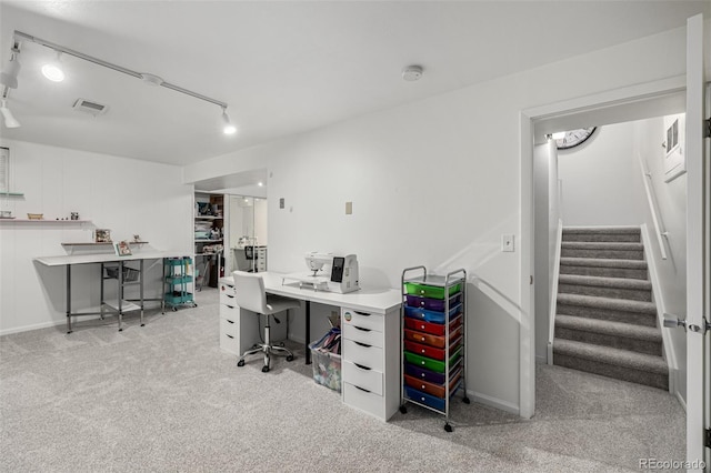 carpeted home office featuring visible vents and track lighting