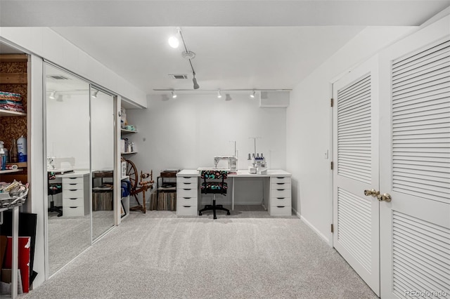 carpeted office with visible vents and rail lighting