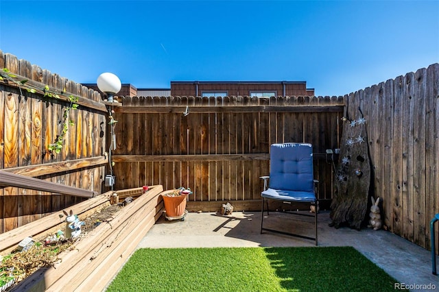 view of patio / terrace featuring fence