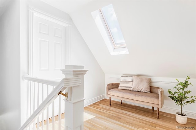 3346 W 30th Ave, Denver, CO 80211 - sitting room with a skylight, vaulted ceiling, and light wood-type flooring
