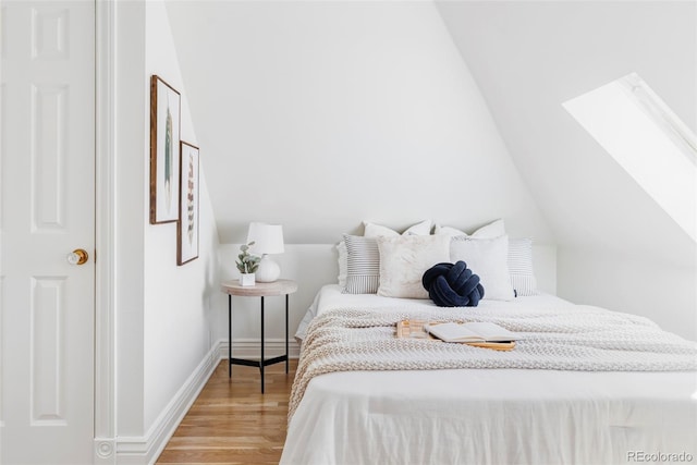 3346 W 30th Ave, Denver, CO 80211 - bedroom featuring a skylight, light wood-style floors, and vaulted ceiling