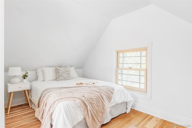3346 W 30th Ave, Denver, CO 80211 - bedroom with vaulted ceiling and wood finished floors