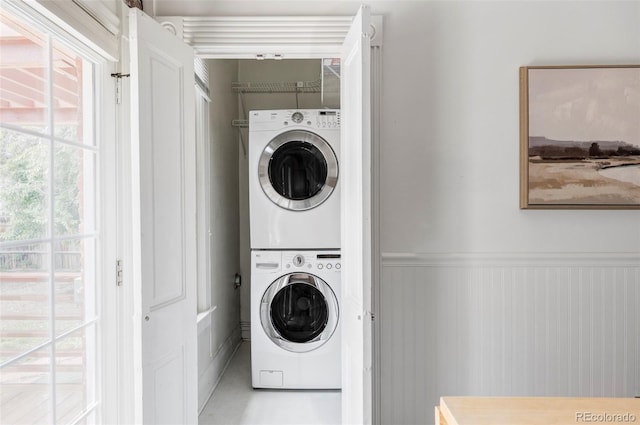 3346 W 30th Ave, Denver, CO 80211 - laundry room featuring stacked washer and clothes dryer and wainscoting