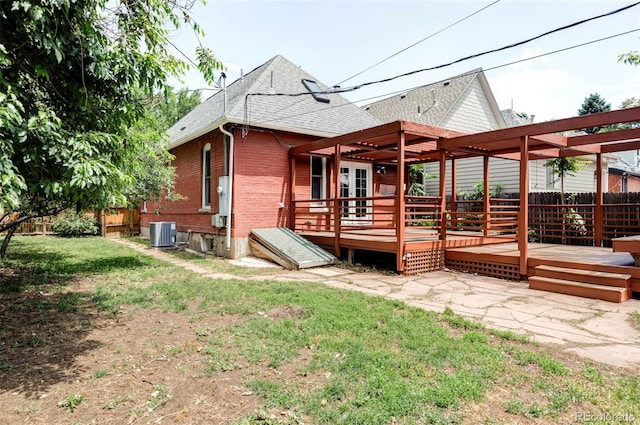 3346 W 30th Ave, Denver, CO 80211 - rear view of house with roof with shingles, a wooden deck, brick siding, and a pergola