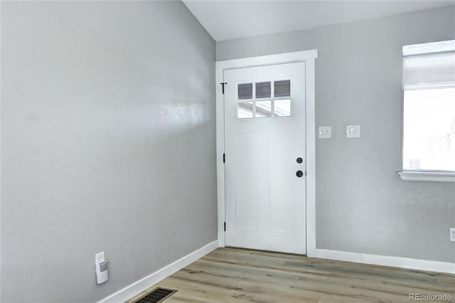 entryway with light hardwood / wood-style floors