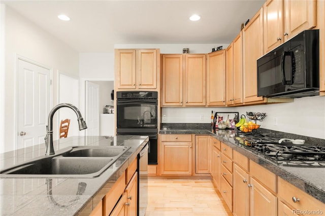 13664 Cherry St, Thornton, CO 80602 - kitchen with a sink, light brown cabinets, black appliances, and recessed lighting