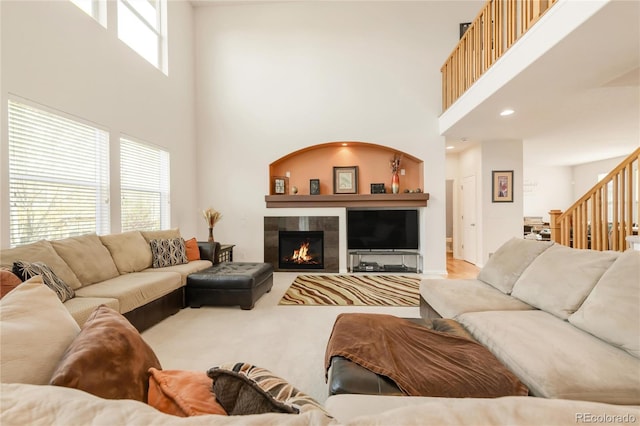 13664 Cherry St, Thornton, CO 80602 - living area with a tiled fireplace, a towering ceiling, and stairway