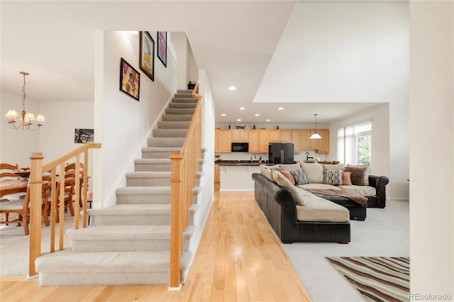 13664 Cherry St, Thornton, CO 80602 - interior space featuring stairs, a notable chandelier, light wood-type flooring, and recessed lighting