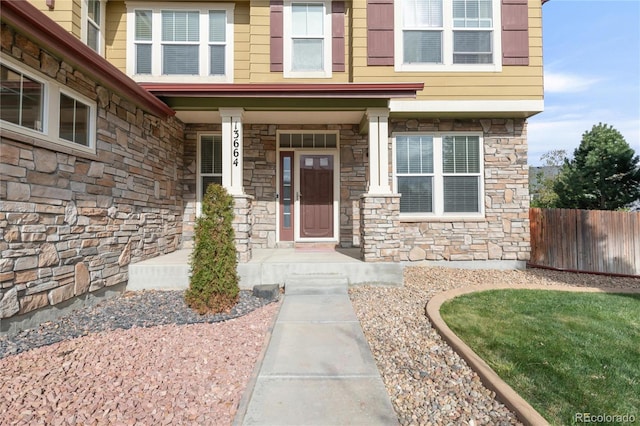13664 Cherry St, Thornton, CO 80602 - property entrance featuring stone siding and fence