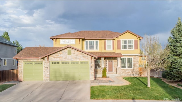 13664 Cherry St, Thornton, CO 80602 - view of front of property featuring driveway, fence, a garage, stone siding, and a front lawn