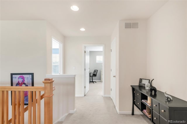 13664 Cherry St, Thornton, CO 80602 - hall with recessed lighting, baseboards, visible vents, light carpet, and an upstairs landing