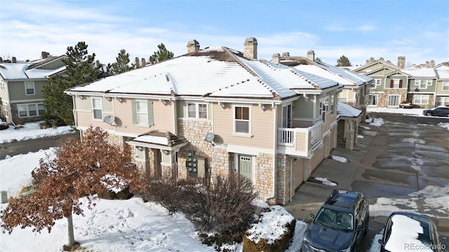 view of front of house featuring stone siding and a residential view