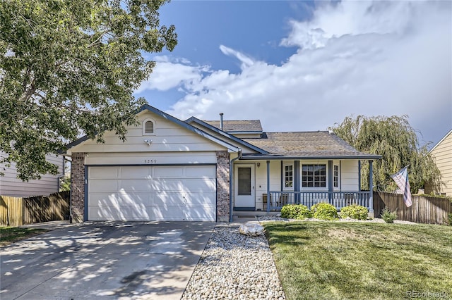 single story home featuring covered porch, a front lawn, and a garage