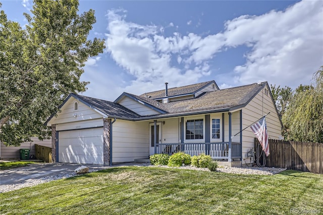 ranch-style house with covered porch, a garage, and a front yard