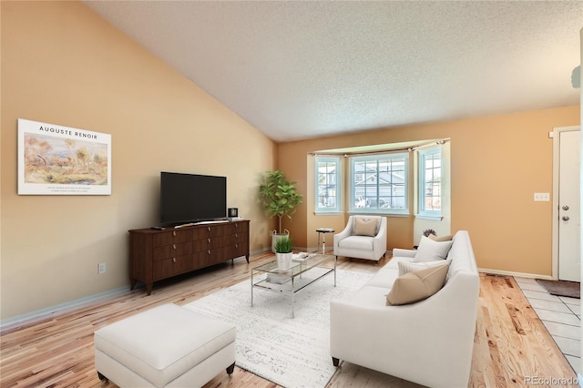 living room featuring a textured ceiling and light wood-type flooring