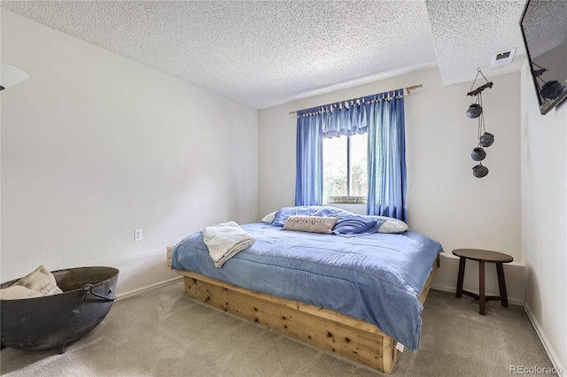 carpeted bedroom with a textured ceiling