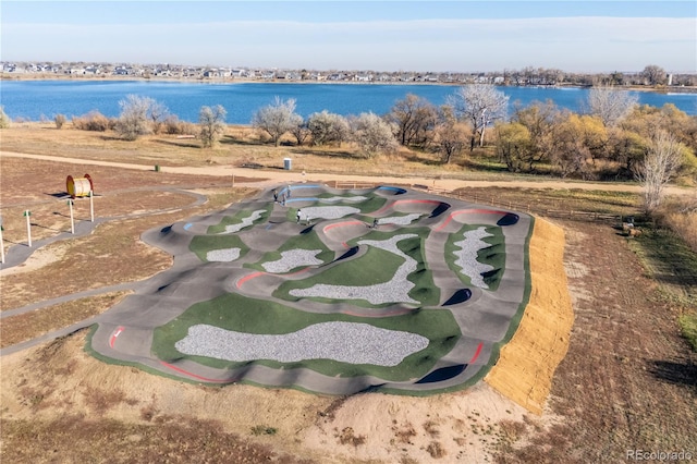 birds eye view of property featuring a water view