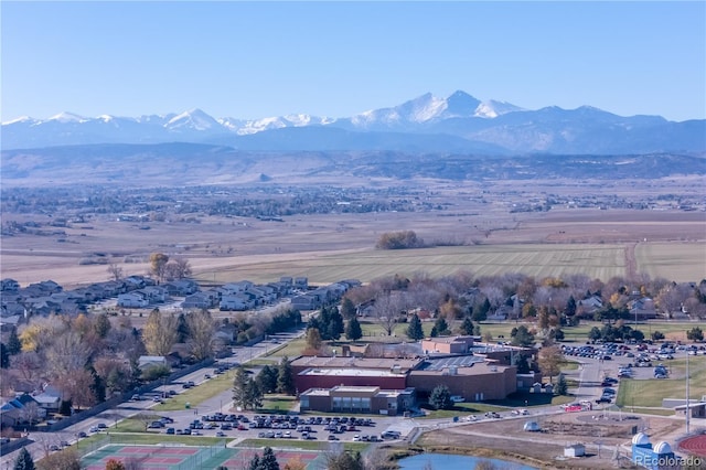 birds eye view of property with a mountain view