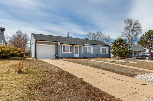ranch-style home featuring roof with shingles, concrete driveway, and an attached garage