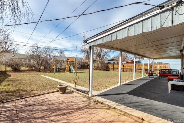 view of patio / terrace featuring a fenced backyard and a playground