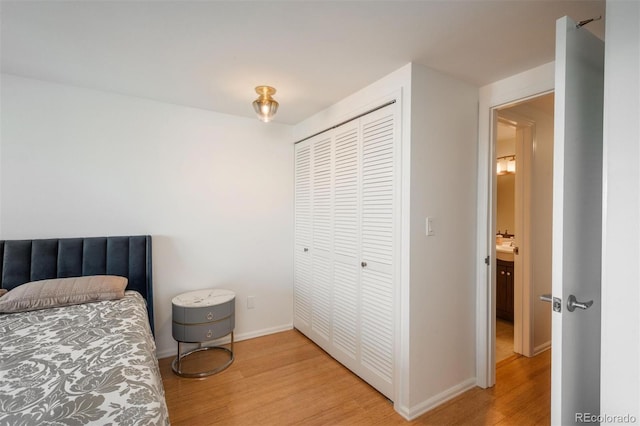 bedroom with a closet and light wood-type flooring