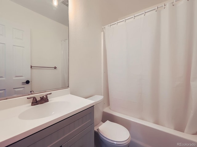 bathroom with visible vents, shower / tub combo, vanity, and toilet