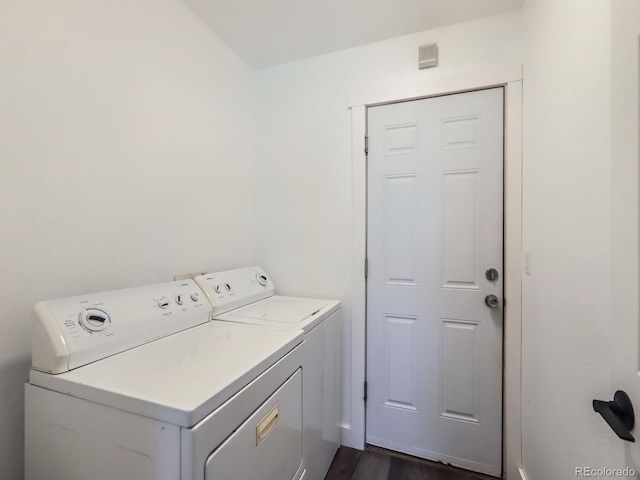 laundry area featuring laundry area, visible vents, and separate washer and dryer