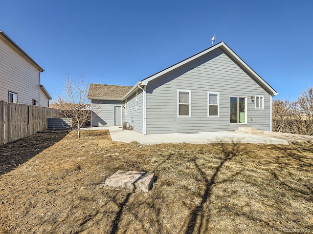 back of property featuring a patio area and fence