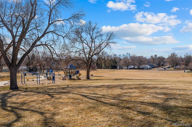 surrounding community featuring a lawn and playground community