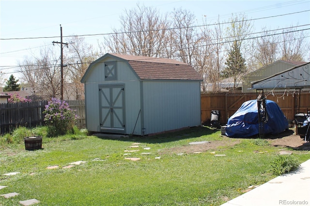 view of shed featuring a fenced backyard