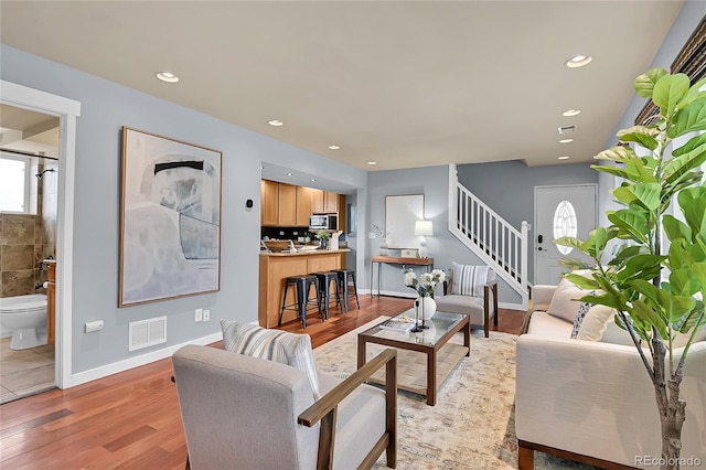 living room with light hardwood / wood-style flooring