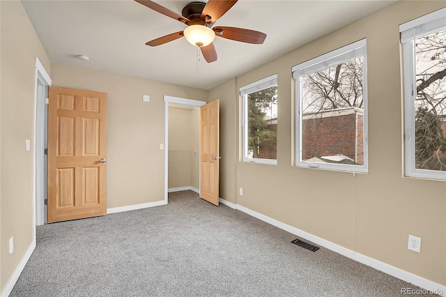 unfurnished bedroom featuring carpet flooring and ceiling fan