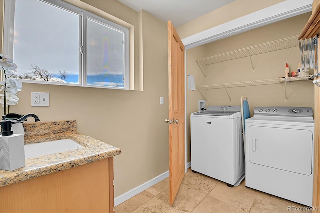 washroom with sink and washing machine and dryer