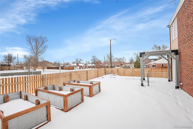 yard covered in snow with a pergola