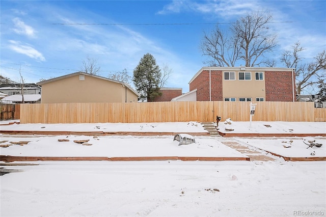 view of yard layered in snow