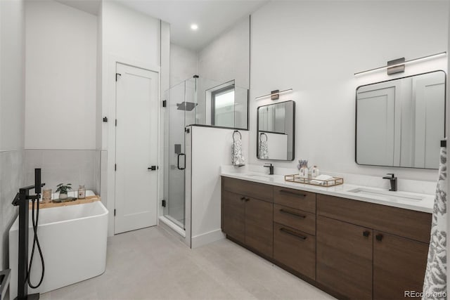 21 Washington Ave, Golden, CO 80403 - bathroom featuring a stall shower, double vanity, and a soaking tub