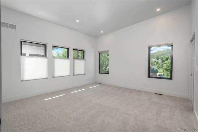 21 Washington Ave, Golden, CO 80403 - empty room with healthy amount of natural light, recessed lighting, and light carpet
