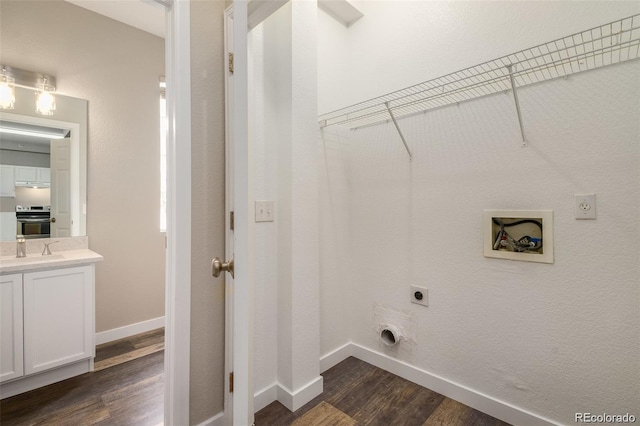 laundry room with dark hardwood / wood-style floors, electric dryer hookup, and hookup for a washing machine