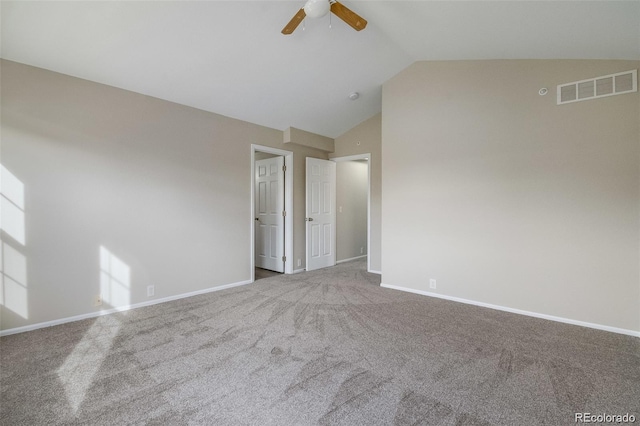 interior space featuring vaulted ceiling, light colored carpet, and ceiling fan