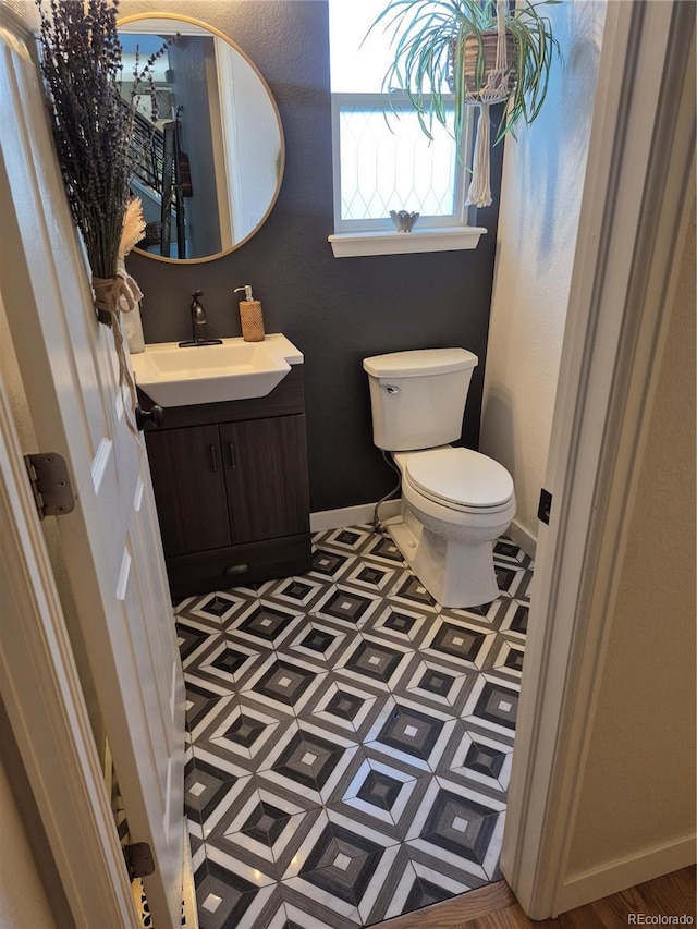 8229 Cottongrass Ct, Castle Pines, CO 80108 - half bathroom with vanity and toilet