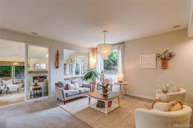 8229 Cottongrass Ct, Castle Pines, CO 80108 - living area featuring plenty of natural light, light carpet, and a chandelier