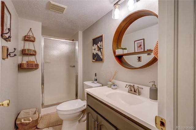 8229 Cottongrass Ct, Castle Pines, CO 80108 - full bath featuring vanity, a shower stall, a textured ceiling, and a textured wall