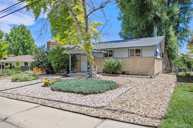 1026 Spencer St, Longmont, CO 80501 - single story home with brick siding and roof with shingles