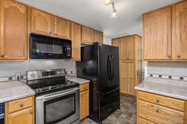 1026 Spencer St, Longmont, CO 80501 - kitchen with black appliances, tasteful backsplash, and light countertops